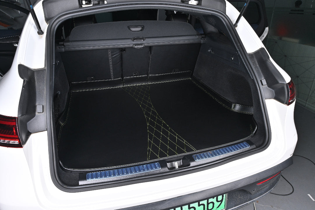 black leather with green stitching car mat