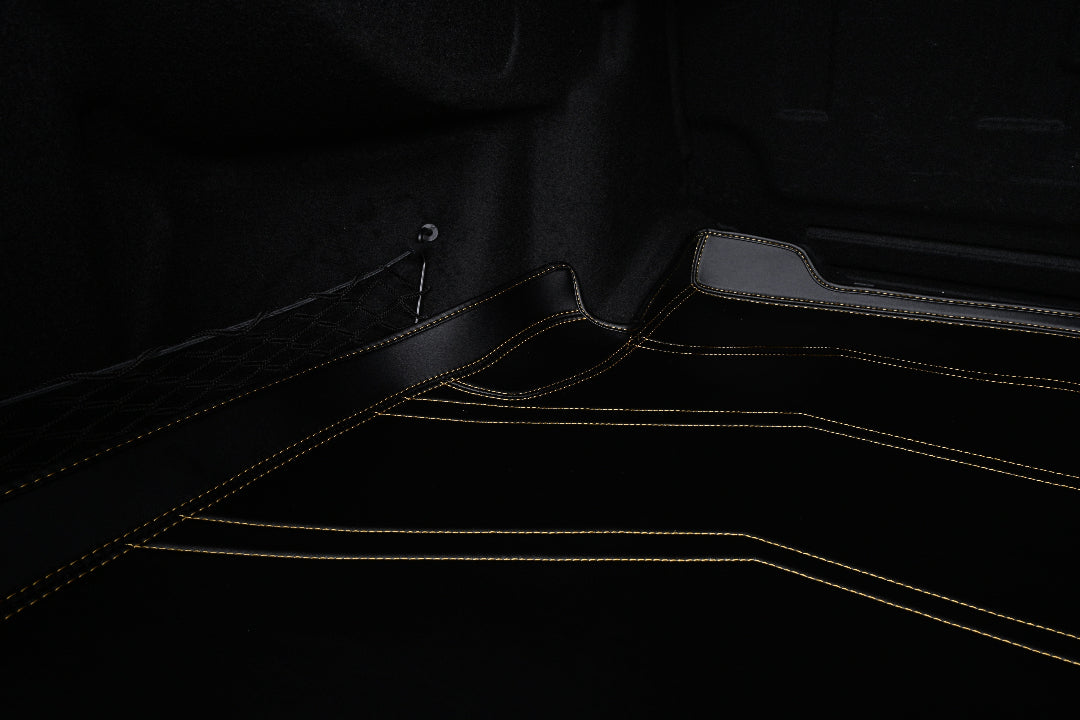 black leather with yellow stitching cargo mat
