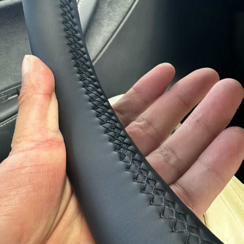 detail of steering wheel cover for tesla model